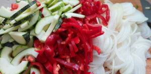 Sliced zucchini, bell peppers and onions for pickled zucchini