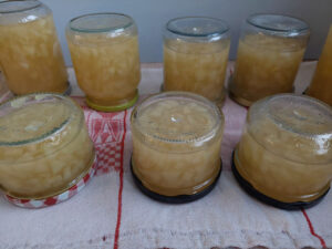 Jam jars upside down on a towel