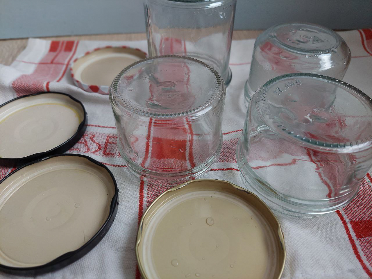 Sterilised jars on a kitchen towel
