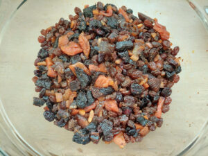 Mixed dried fruit in a bowl, soaked with brandy for a few days.