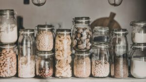 Different grains in jars on a shelf