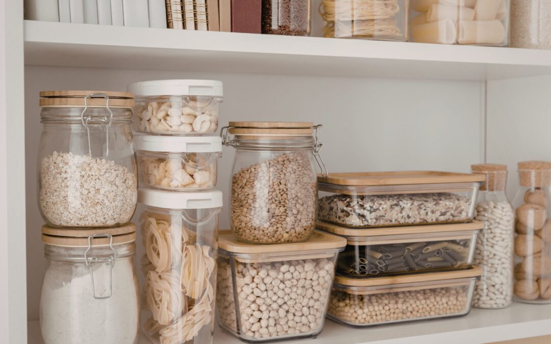 Pantry shelves with different food items in plastic containers