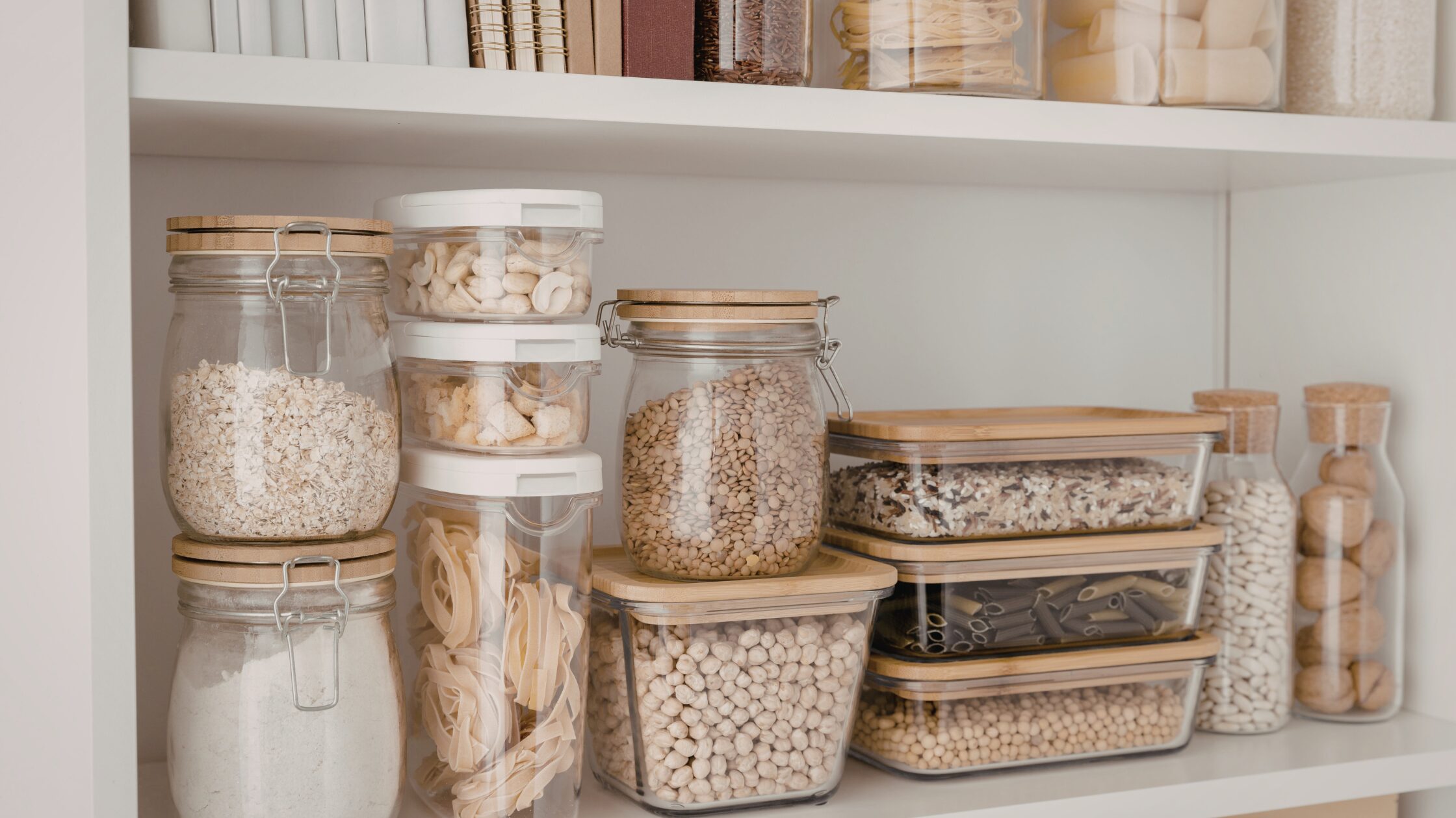 Pantry shelves with different food items in plastic containers