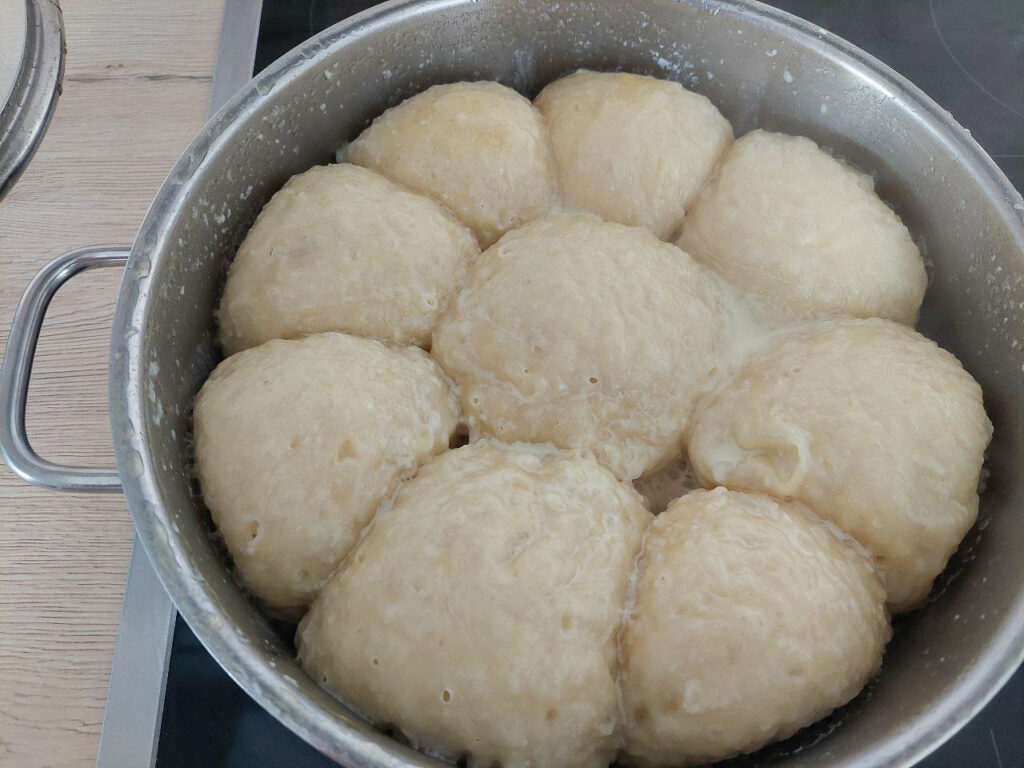 Freshly steamed Dampfnudeln in a pot