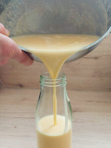 Filling Eierlikör into a bottle