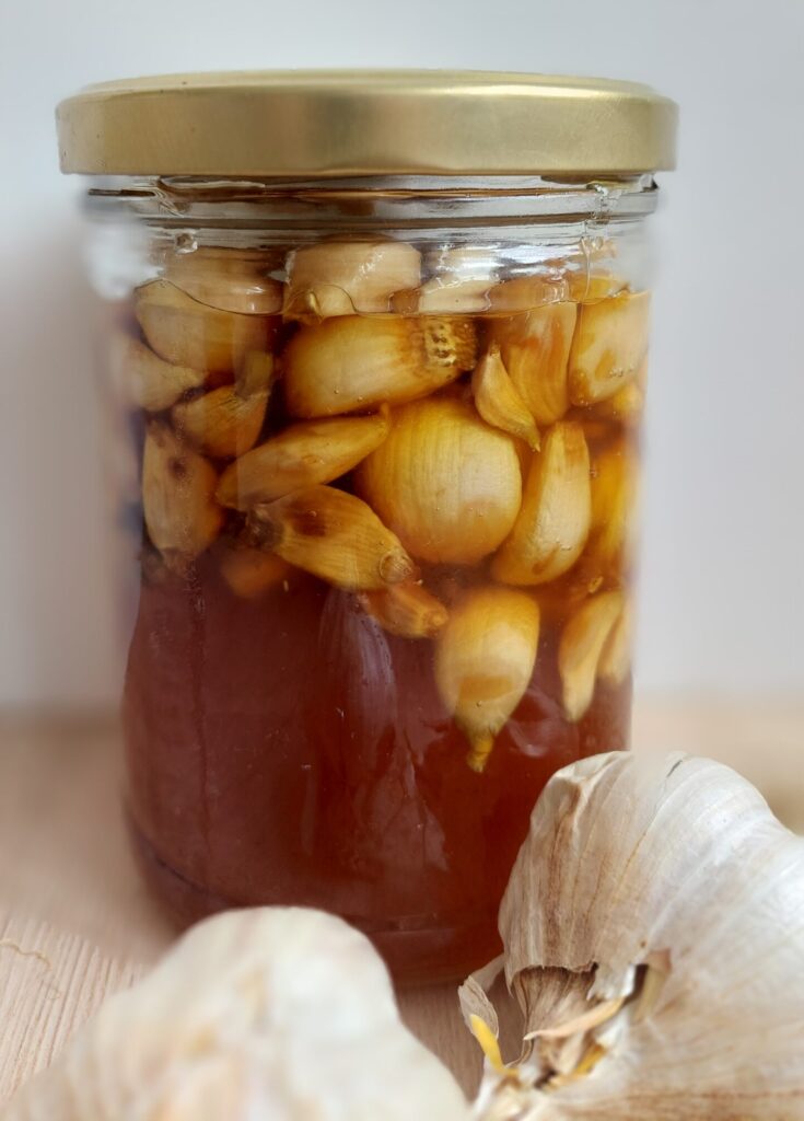 Fermented garlic in honey in a jar