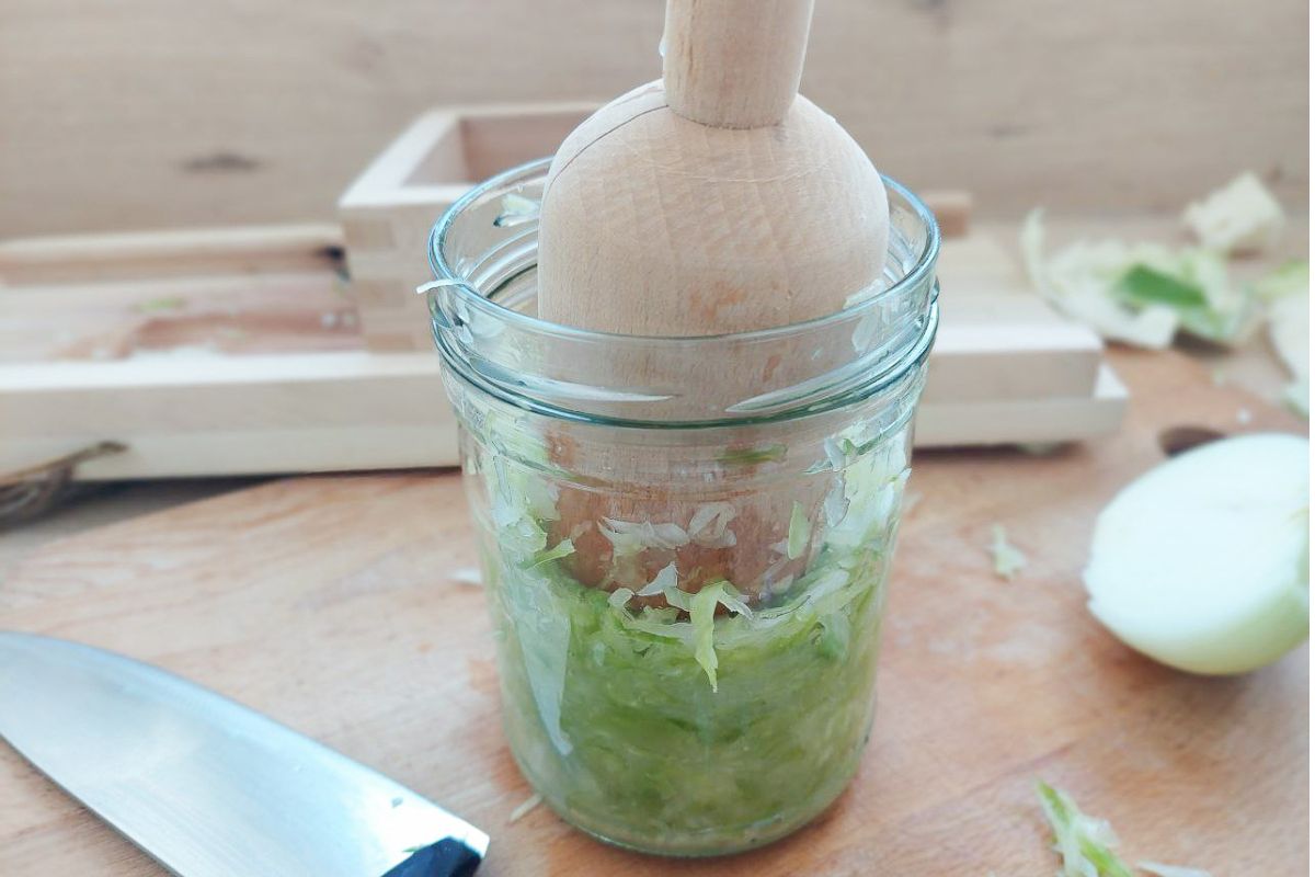 Fermentation - sauerkraut Cabbage in a jar, tamper above, soon to become sauerkraut